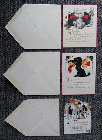Image for 3 VINTAGE CHRISTMAS CARDS - 1. CAT.  2. DOG.  3. CHILDREN CAROLLING.  WITH ORIGINAL ENVELOPES.